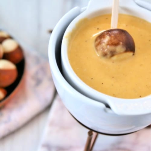 Cheese fondue with dipping pretzel