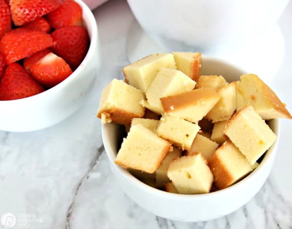 white bowl of cubed pound cake for fondue
