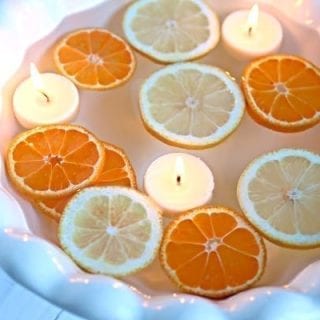 floating sliced citrus with candles