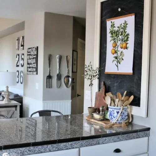 botanical poster on chalkboard in a kitchen