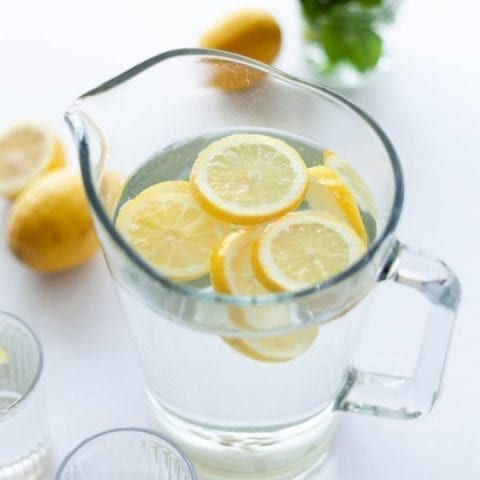 water pitcher with sliced lemons