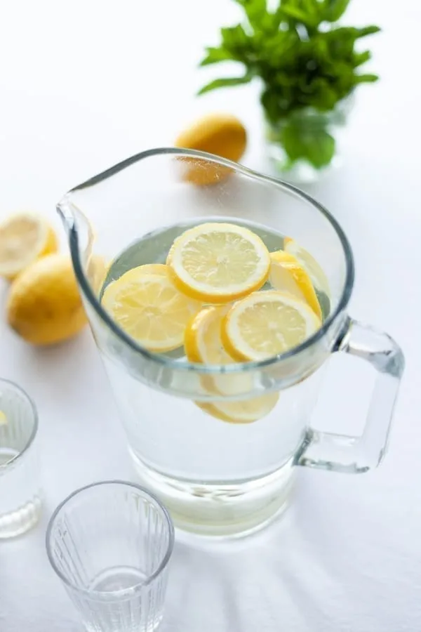 water pitcher with sliced lemons