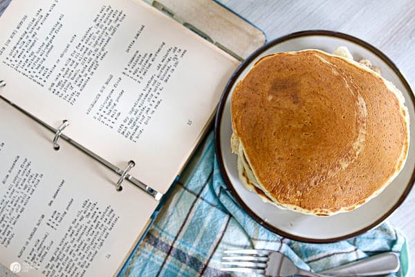 overhead shot of pancakes and a recipe book