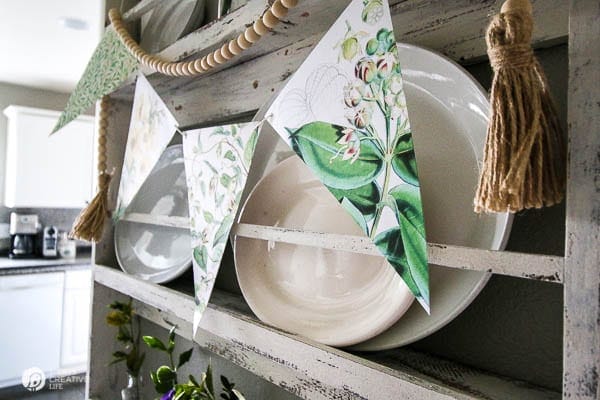 Paper Banner Hanging on Wall Plate Rack