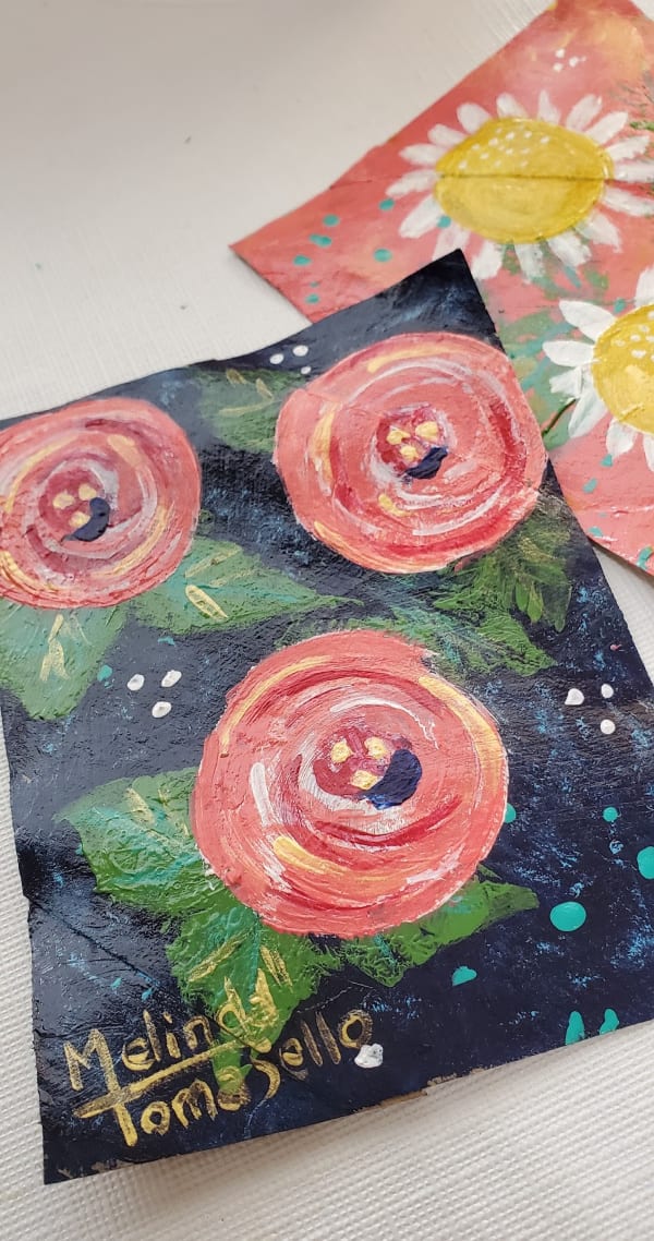 painted flowers on cardboard squares