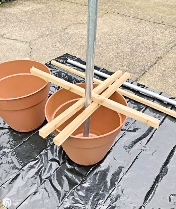 Planter with a pole and wood braces -Poles for Outdoor Lights