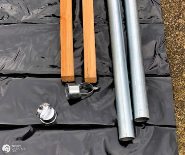 Supplies for making planter light poles: Wood, pipe and pipe caps -Poles for Outdoor Lights