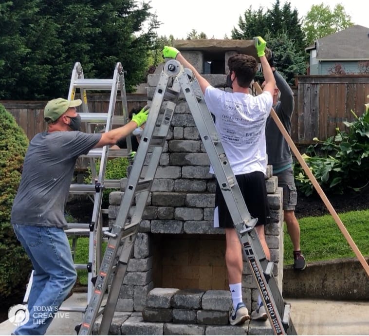 Men building an outdoor fireplace