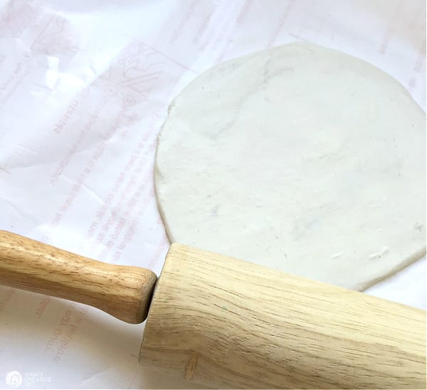 Rolling pin with rolled out white clay