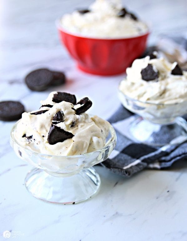 Red bowl and 2 dessert cups with oreo fluff dessert