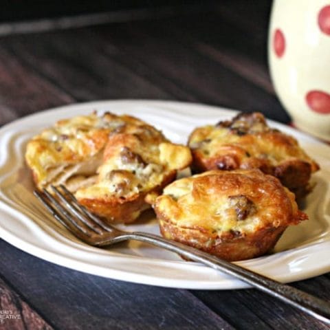 3 egg muffin bites on a white plate.