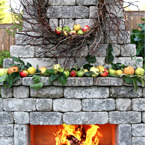 outdoor stone fireplace with fall mantel