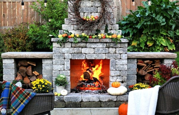 Rustic Outdoor Fall Decorating Ideas with an outdoor fireplace