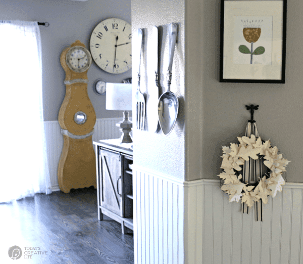 A view of a fall decorated home with a hanging diy paper leaf wreath