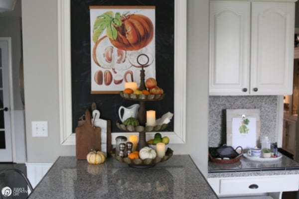 Kitchen decorated for Fall with botanical pumpkin poster