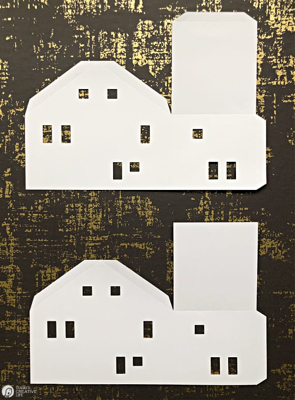 2 cut out paper house templates, ready to fold.