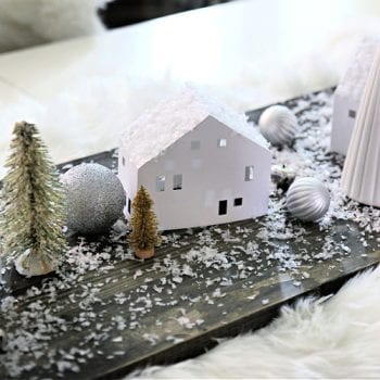 white paper house in a table centerpiece for Christmas