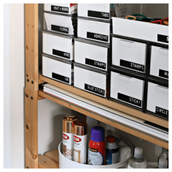 Organized craft closet with containers and labels