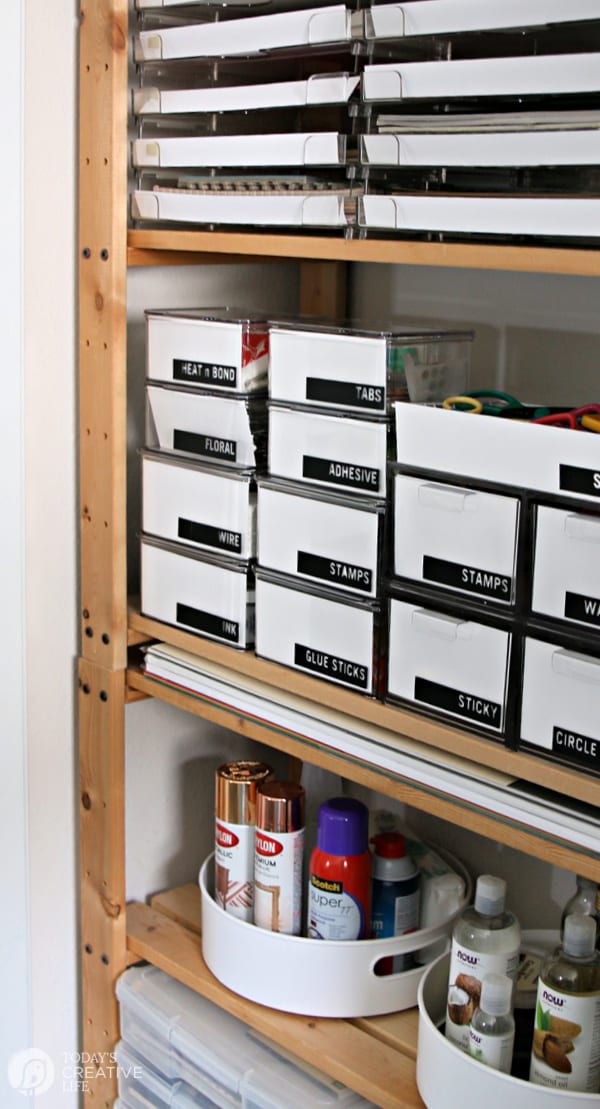 Craft Room Organization shelving with organized containers and labels. 