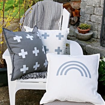 White chair with 3 decorative pillows for DIY Patio Ideas on a budget