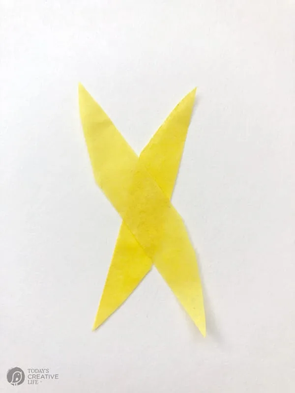 Tissue paper strips crossed into an X