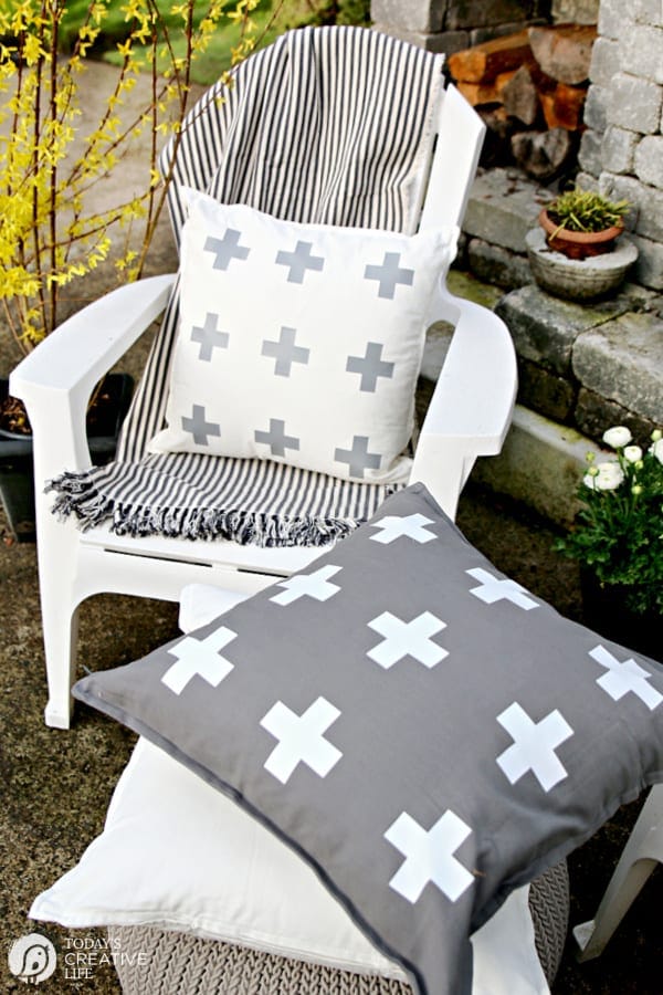 White Chair with White pillow and striped throw. Cricut Maker Iron-on Craft