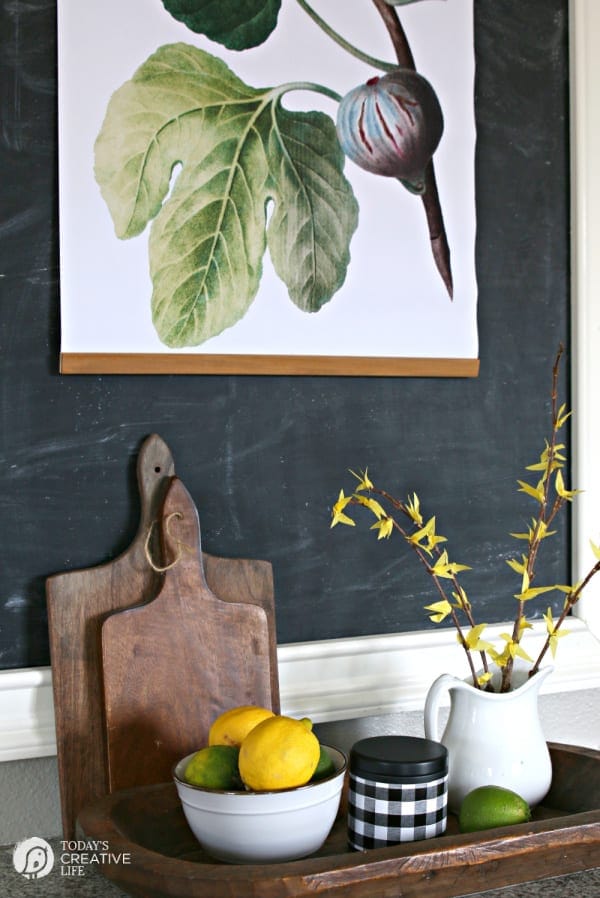 Spring decor in a kitchen with lemons and a bouquet of diy faux forsythia branches