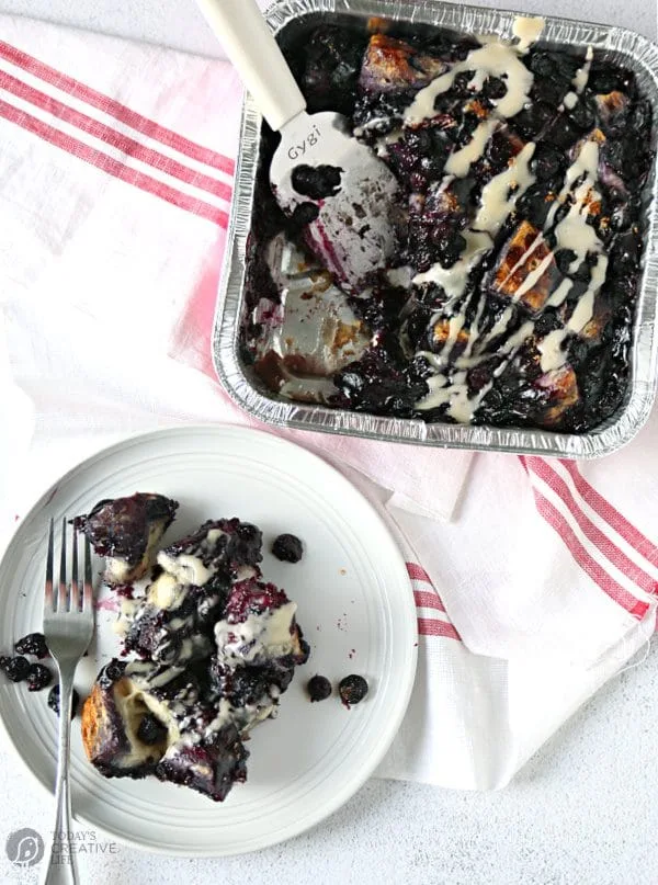 Blueberry Bubble Bread served on a white plate overhead shot with icing glaze