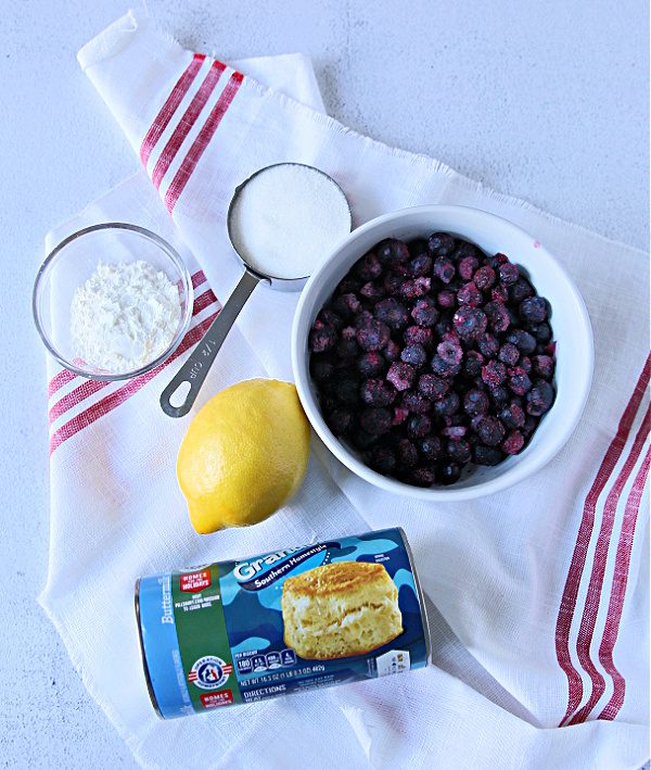 Ingredients for making Blueberry Bubble bread: Frozen blueberries, corn starch, refrigerated biscuits, sugar and lemon.