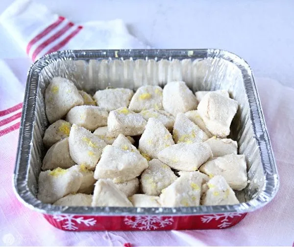 disposable baking pan with quartered biscuits