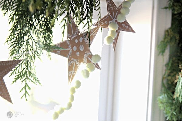 brown paper star banner hanging in window