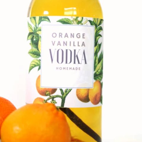 Glass bottle with orange vanilla infused vodka recipe.