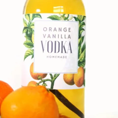 Glass bottle with orange vanilla infused vodka recipe.