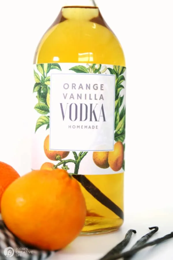 Glass bottle with orange vanilla infused vodka recipe.