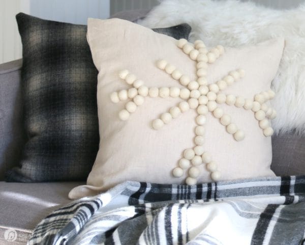 Winter decorative DIY snowflake pillow on sofa