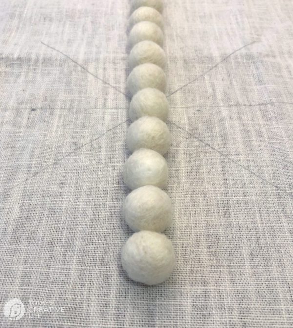 Wool Balls Glued in a line