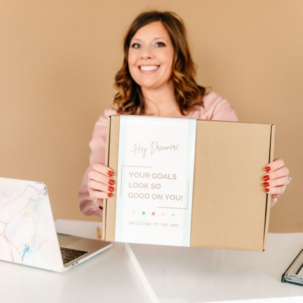 Woman holding the Vision Board Kit Box