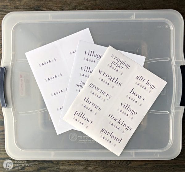 Clear storage tote with 3 sheets of labels on top