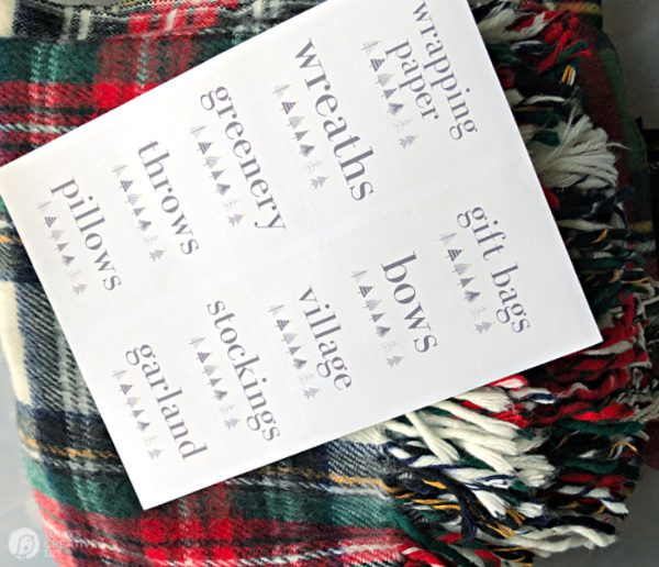 Plaid holiday throws with a sheet of organizing labels | Organizing for Christmas