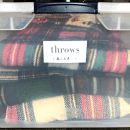 plaid blankets in a tote