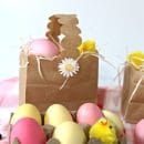 Brown paper bag made into an Easter Basket. Yellow and pink faux eggs.