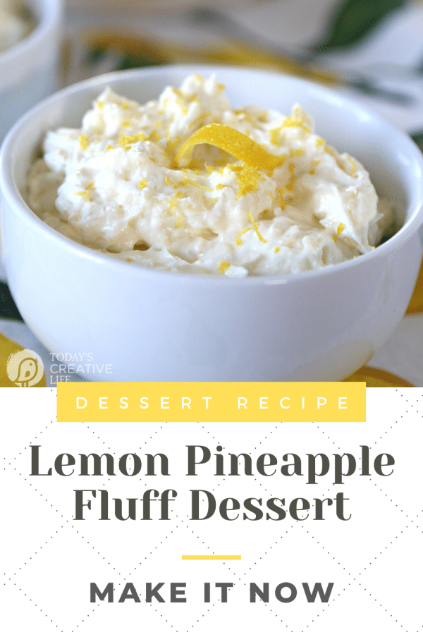 Pineapple Lemon Fluff Dessert served in a small white bowl with a lemon twist garnish on top.