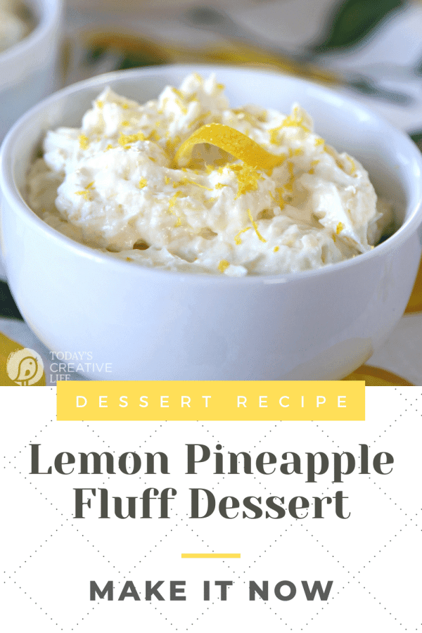 Pineapple Lemon Fluff Dessert served in a small white bowl with a lemon twist garnish on top.