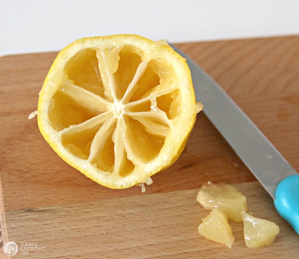 Sliced lemon with the pulp cut out.