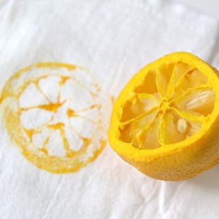 Lemon cut in half & stamped on a white tea towel