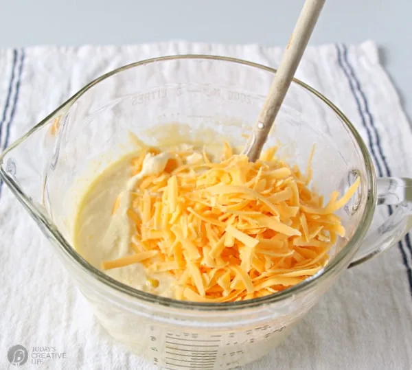 Recipe for Jalapeno Cornbread. Mixing bowl with batter and folding in the cheese.