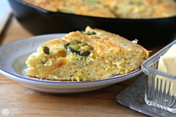 Side view of a sliced piece of jalapeno cornbread.