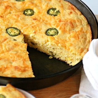 Cornbread with Jalapenos baked in a cast iron skillet.