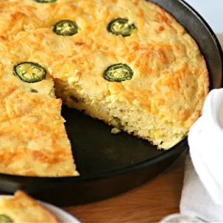 Cornbread with Jalapenos baked in a cast iron skillet.