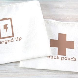 White canvas pouches with a swiss cross and charging symbol.